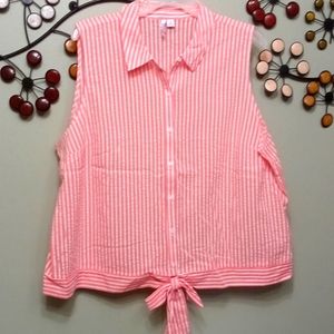 Women's sleeveless button up shirt with tie in front bottom.